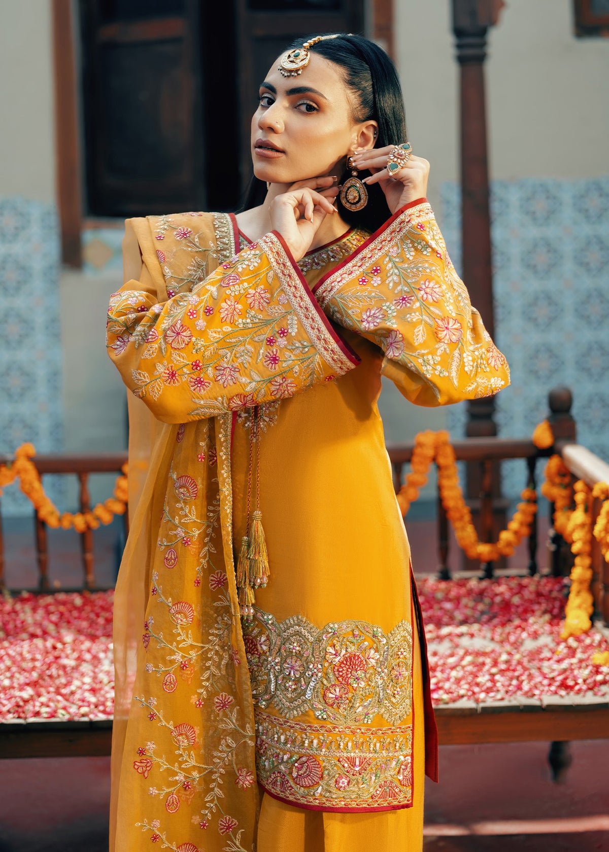 Model showcasing a yellow Jamnii Orchard silk 3 piece suit at Buraq Store