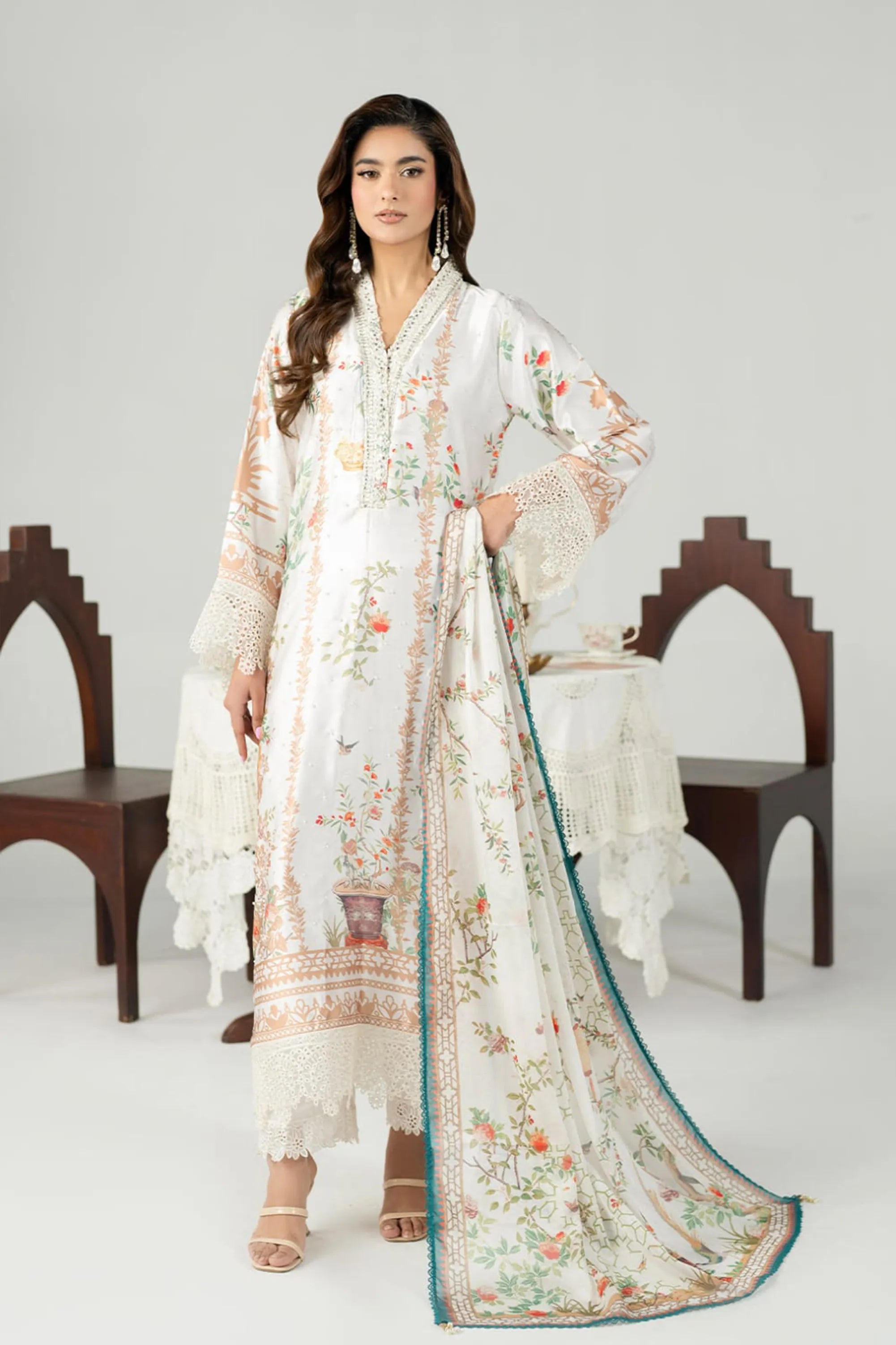 female dressed in white salwar kameez daisy design buraqstore